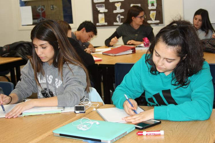 Senior Julia Hernandez and junior Elizabeth Carrasco take in the words of the novela and try to interpret what it means. "I learned Spanish when I was a baby so explain and understanding the novela came easy to me," Hernandez said.