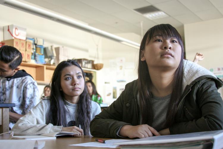 Sophomores Jade Balagtas and Alexa Duenas silently pay attention to the presenter, eager to see the reaction from the experiment.