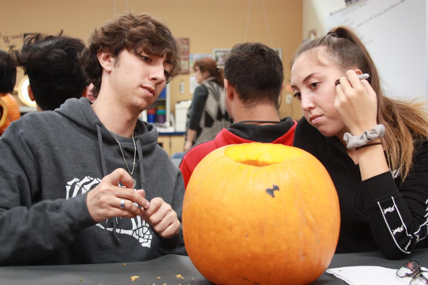 Seniors carve Edgar Allen Poe stories onto pumpkins