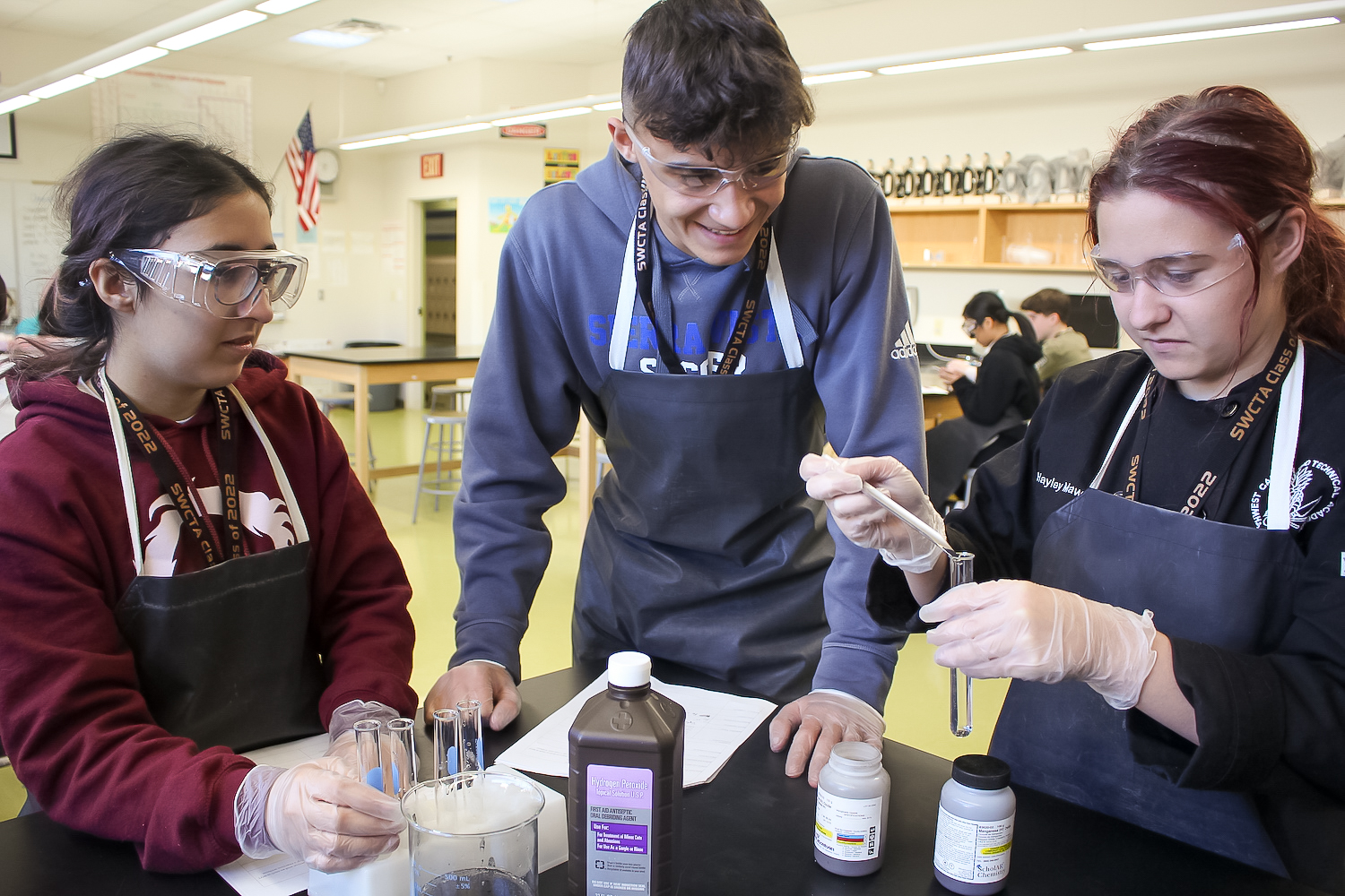 Chemistry students perform lab on types of reactions