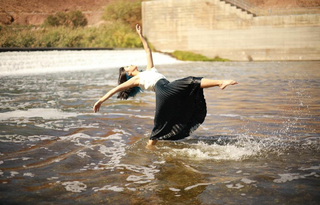 Posing for her picture in the lake, freshman Danika Molina holds her stance. Molina has been a dancer since she was two years old and has ever since competed. “ I love my sport because it allows me to express myself when I can’t find the right words.” 
Photo credits: Evolve Dance Center
