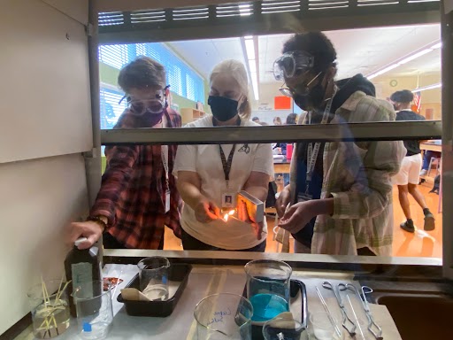 Students conduct the “fire bubbles” experiment which includes creating a reaction using fire and hydrogen peroxide. They worked together and used their critical thinking skills, along with following directions, to successfully complete the lab.  “I love labs,” Sager said. “I love reacting things because sometimes labs fail and then you have to troubleshoot.”
 Photo Credit: Madelynn Evans