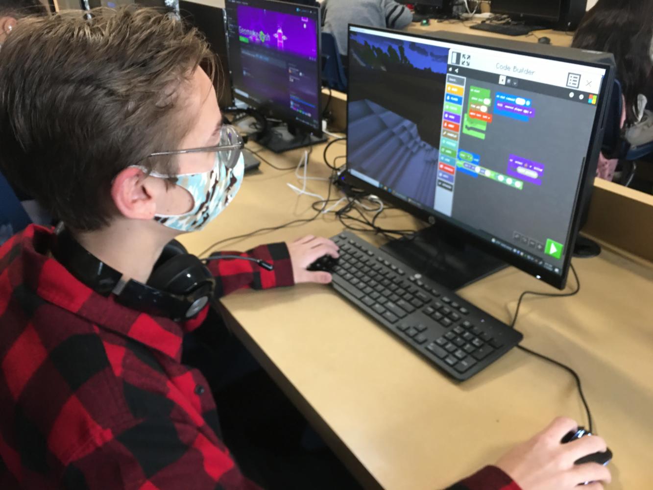 Block+coding+on+the+new+engine%2C+Minecraft%2C+sophomore+Jaxson+Mccoy+begins+to+build+various+code+compilations.+Students+have+been+exploring+the+many+different+features+of+Minecraft.+%E2%80%9CI+love+how+easy+it+is+to+understand+and+repeat%2C%E2%80%9D+Mccoy+said.%E2%80%9CI+know+that+for+coding+I+should+push+myself%2C+but+this+is+a+great+way+to+start+or+learn+to+understand+coding.%E2%80%9D+