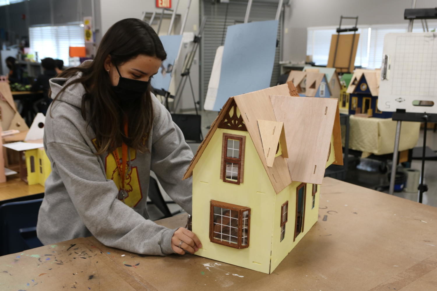 Interior Design III students construct wooden dollhouses