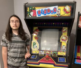 Standing beside his personal “Dig Dug” cabinet, freshman Nicholas Arone is working towards adding more machines to his collection. He has had an interest in arcade games since five years old. “My dream cabinet is a six player ‘X-Men’ or a dedicated ‘Ghosts and Goblins’ cabinet,” Arone said. “But my favorite game from the old school era is ‘DigDug.’”