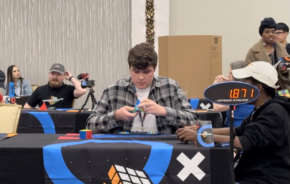 Competing in the Vegas Cubing Fall 2023 competition, sophomore Preston Schwartz rushes to solve the Pyraminx puzzle. Schwartz has competed in various competitions to display his skills. “The Pyraminx [puzzle] is my best event,” Schwartz said. “It’s the one that I focus the most on.”

