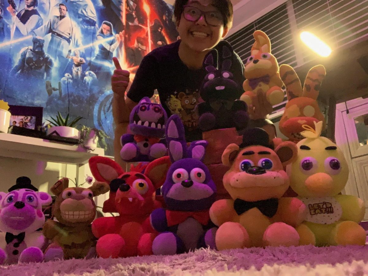 Standing beside their prized plushies, sophomore Marcrow Farinas has grown their collection bit by bit. “I got my plushies online,” sophomore Marcrow Farinas said. “Sometimes from my parents or birthdays too. My favorite is the Springbonnie plush. I bring it everywhere with me and I clean it at least once a day.”