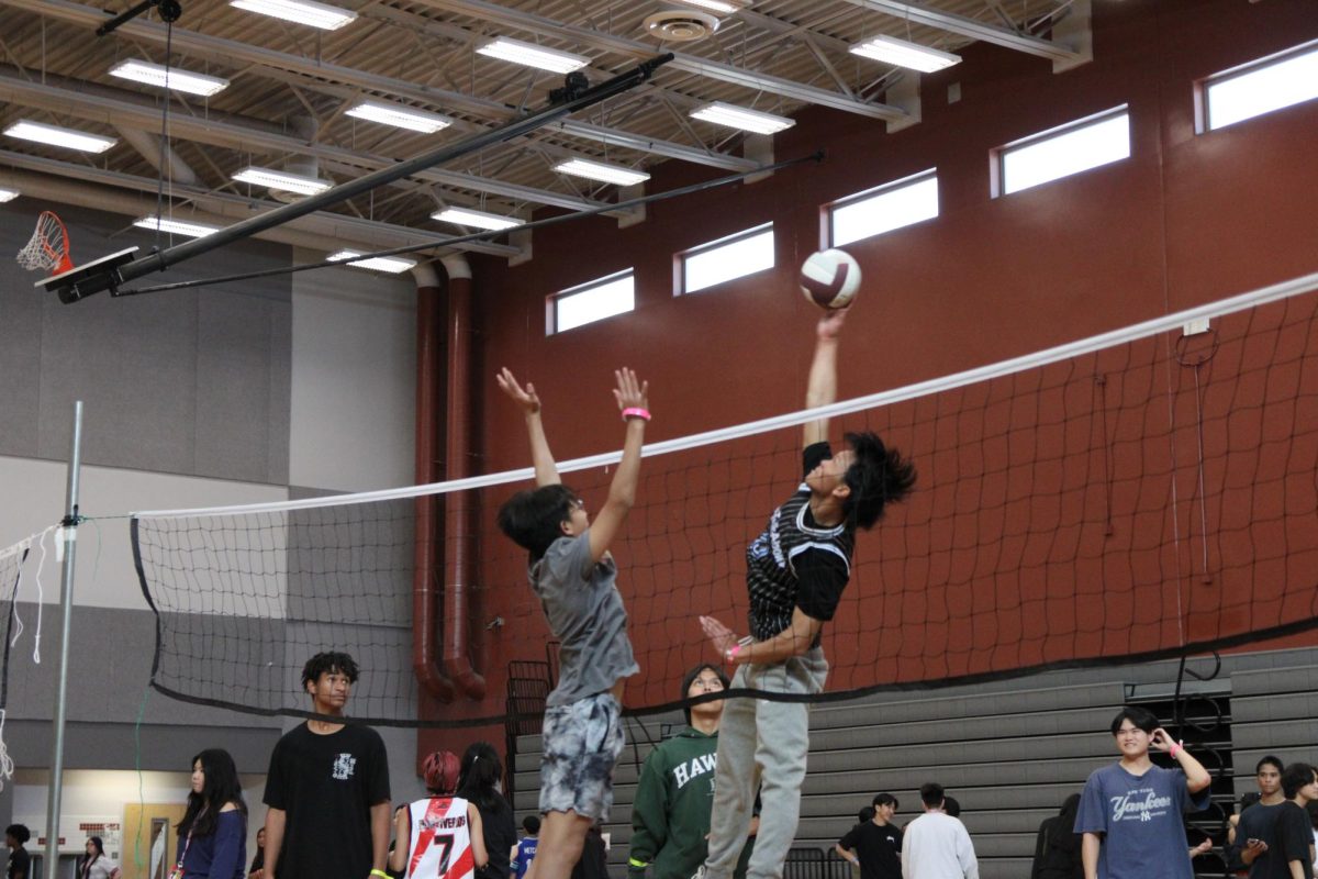 Responding to a high serve, senior Jayson Deguzman leaps just high enough to send the ball back into the other court.

