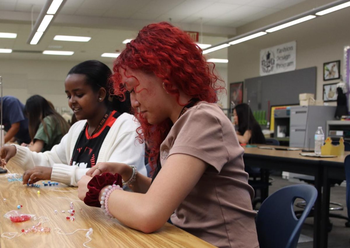 Simultaneously completing a class standard and participating in Senior Sunrise, students designed bracelets for others to wear.