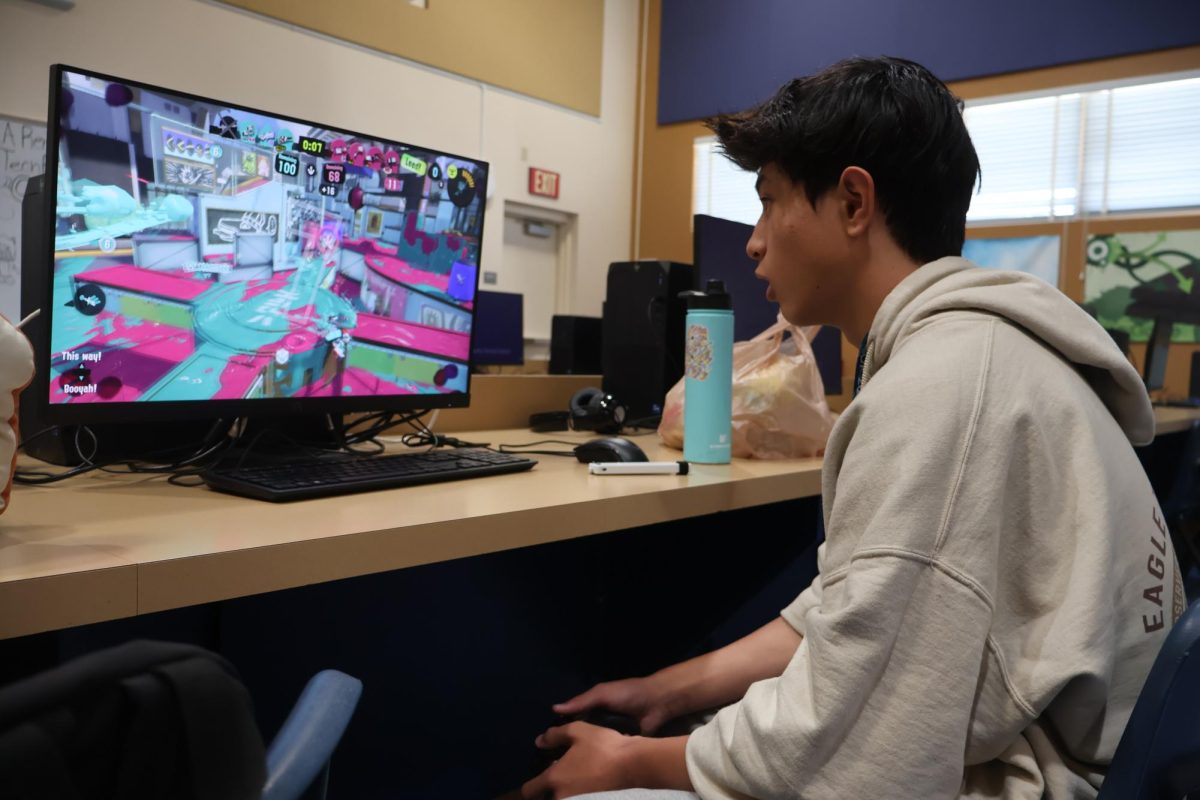 Participating in a Splatoon competition, sophomore Jian Arceo strategically makes his way to the opposing team. Competitive Gaming Club members are able to work in teams and communicate the best strategies to win different competitions. “I felt confident that we were going to win,” Arceo said. “Being able to communicate with teammates was a positive, and I felt we were pretty well coordinated throughout the entire game.” 