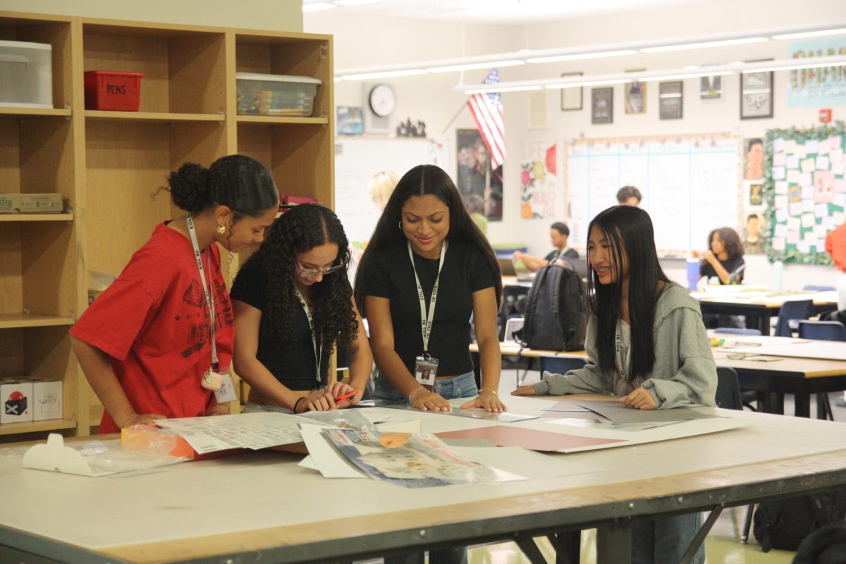 Outlining her shoebox project, sophomore Jaylene Motes leads her group, showing them how to cut out their future classroom. “It’s teaching me ways to make my future students feel safe around me and in my classroom. I like that our class is engaging, that everyone is friends with each other, and that I can talk to my teacher, and that's how I want my class to feel,” Motes said.