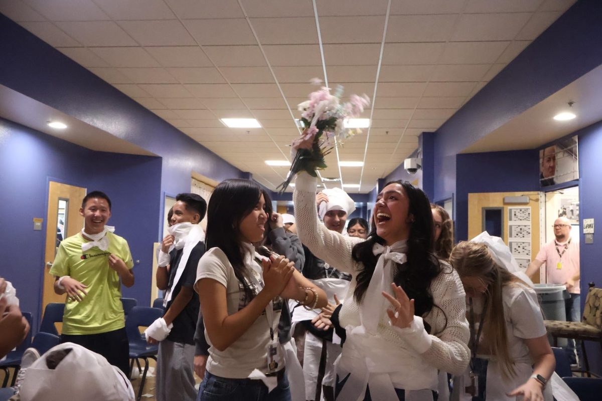 To end the ceremony, the wedding has a bouquet toss, with junior Ava Torres being the one to catch it. “Honestly, I am a very competitive person,” junior Ava Torres said. “My biggest regret last year was probably not catching the bouquet, so I knew that this year failure was not an option. I’m pretty sure I pushed some people aside, but it was worth it. “
