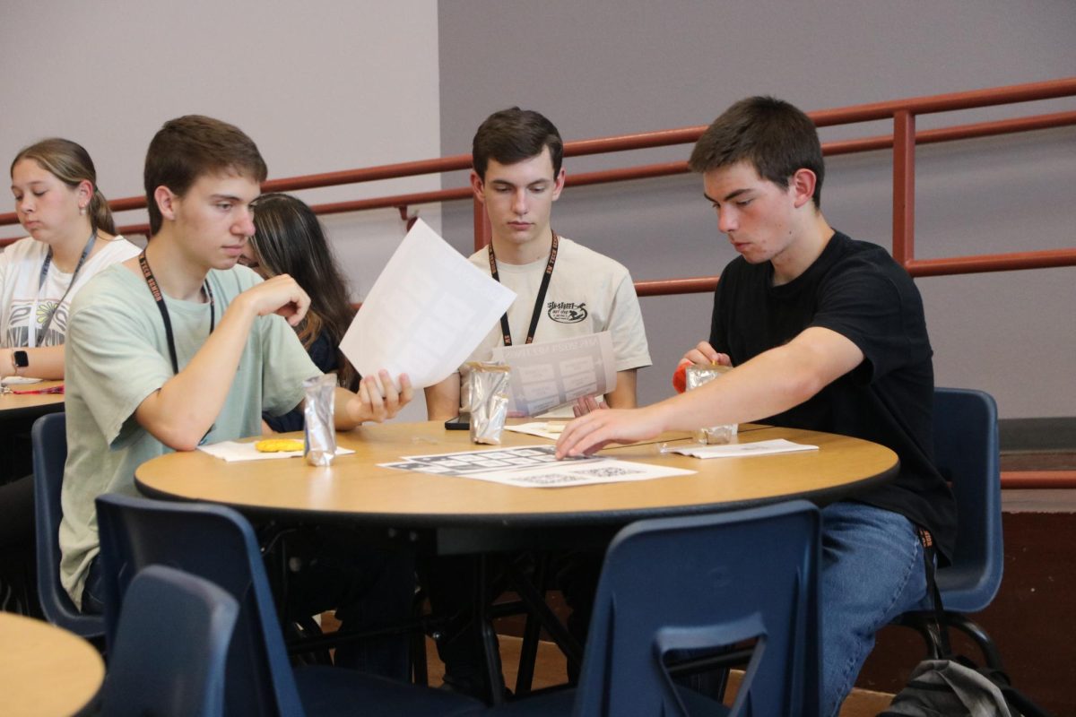 Listening to upcoming NHS events, senior Nathaniel Scherschel looks forward to participating with friends. NHS board members announced their breast cancer walk event, as well as donation opportunities. “I enjoy participating in club events with my friends,” Scherschel said. “I find that being with my friends helps me have motivation to serve my community and it’s a great way to have fun with them outside of school.”
