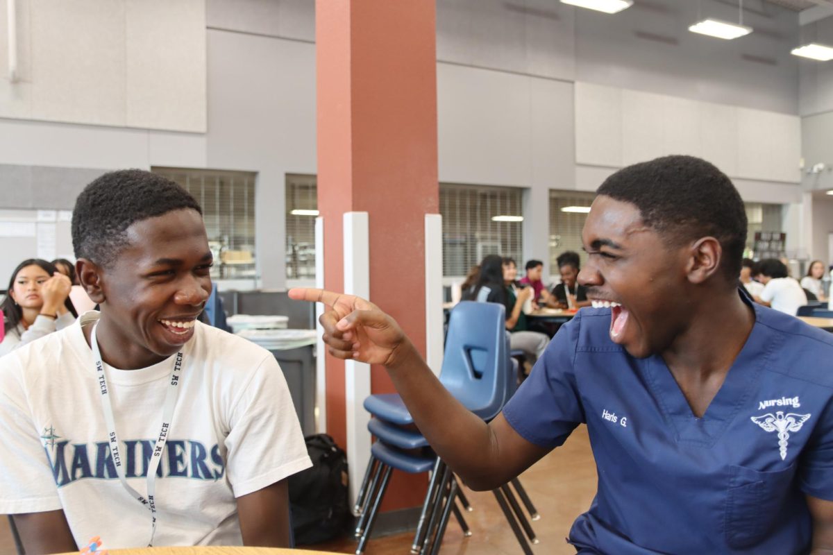 Listening to board members announce upcoming events, senior Harris Gibirila expresses excitement with his brother. Gibirla looked forward to HOSA’s Parent’s Night Out event. “Volunteering at an event that gives kids with down syndrome an opportunity for some freedom sounded really interesting to me,” Gibrila said. “As a volunteer, we would be watching them so they have some form of supervision from a person their age.”