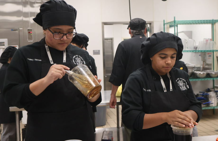 Collaborating alongside each other, sophomores Valery Hernandez and Taelor Williams create a sauce for Spam musubi, which will be featured in this week Coyote Cafe. Last week's cuisine was Vietnamese and North-American, which contained a choice between a bánh mì or reuben sandwich with its corresponding sides. “It’s a great experience,” Williams said. “I feel like I am [benefiting greatly] from this because it reflects what it is like to be working in the back of the house inside of a restaurant.”