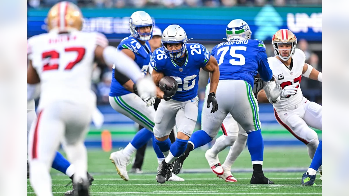 Zach Charbonnet (#26, Seattle Seahawks) runs the ball during an NFL game on Thursday, October 10th, 2024 against the San Francisco 49ers at Lumen Field. Photo Credit: Seattle Seahawks