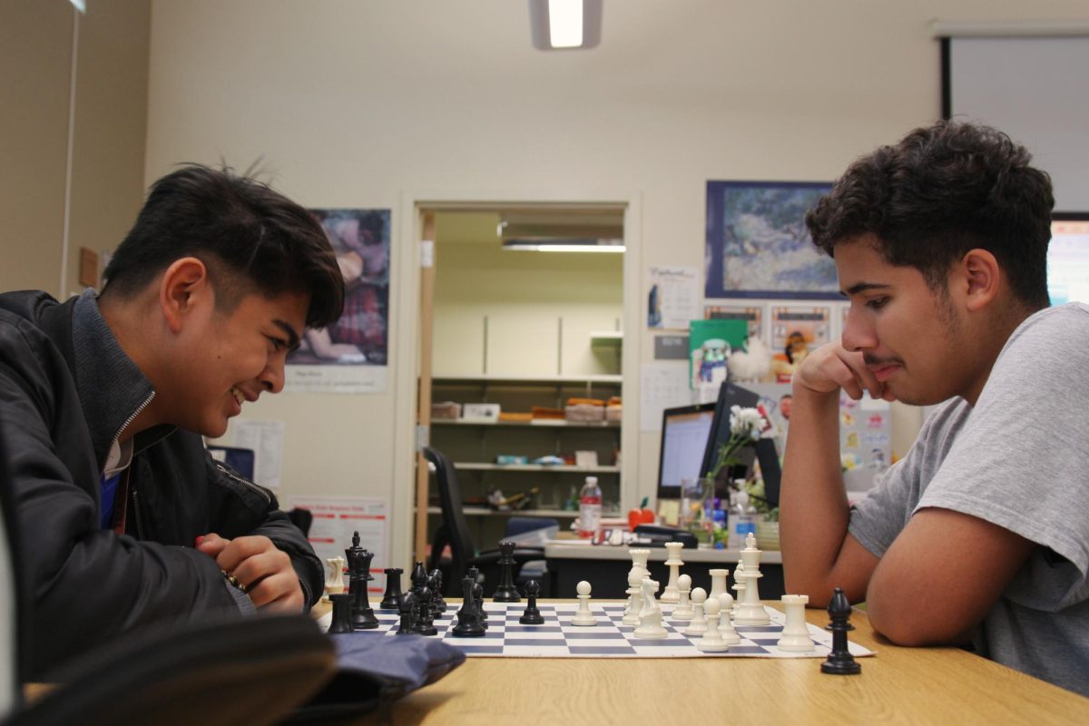 Looking at the position on the board, freshmen Christian Sumaway and Robert Romero thinks about their next move. Both students are regular attendees of chess club. “Being able to go to chess club right after school and playing for an hour or two is always a good use of my time,” Romero said. “Everyone at chess club is very high level so it makes me feel inspired to try and reach them.”