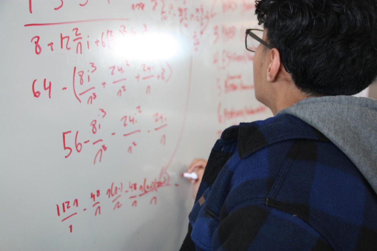 Writing calculus equations on the board, junior Michael Haley easily swifts by the questions with ease. “At the beginning of this year, I was doubting if I could do it,” Haley said. “It was mainly because of this physics class I was taking, I felt like I wasn’t understanding it, and then I wasn’t doing too well on some of the tests. But then I quickly picked it back up and started having momentum again.”