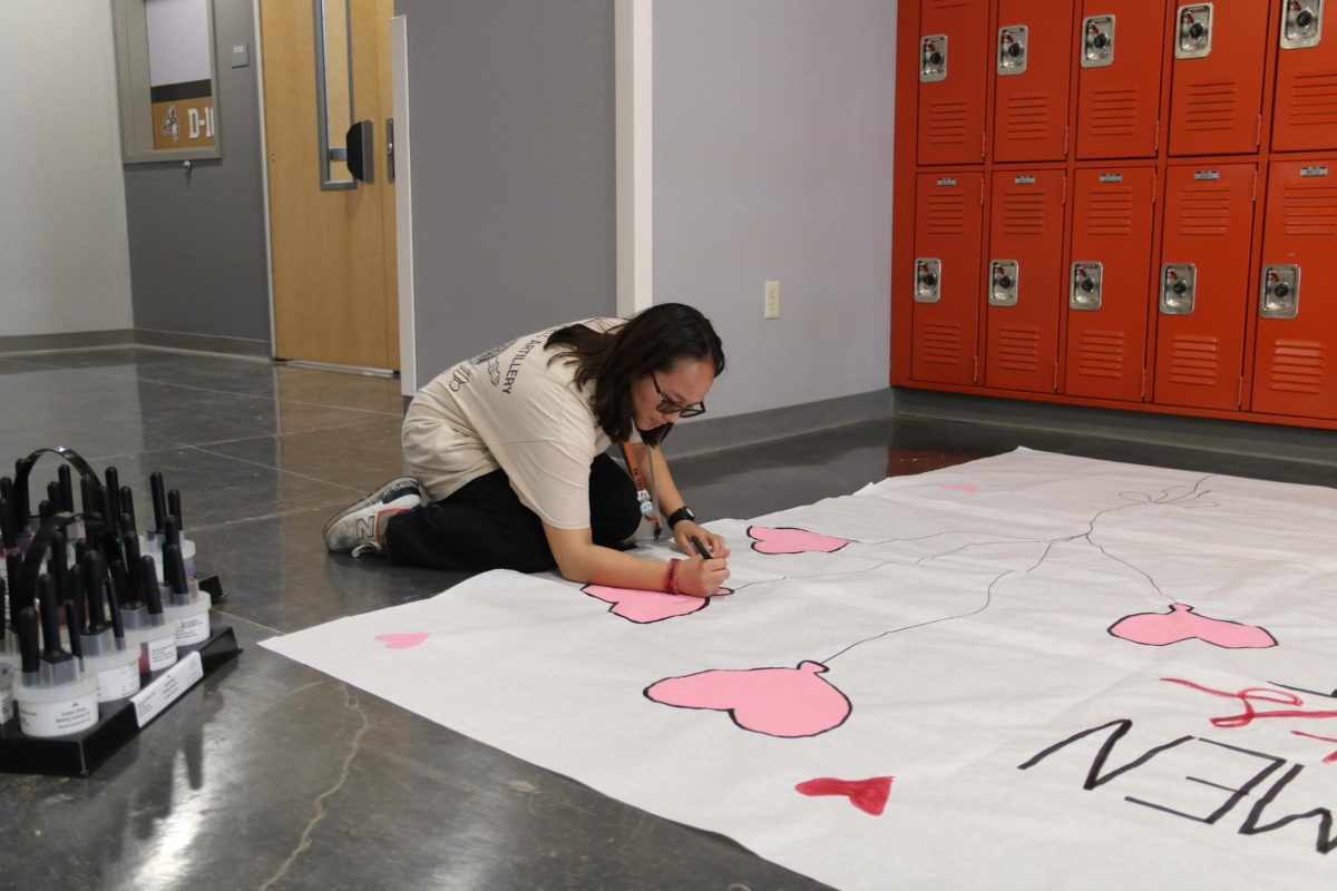 Freshman Class Historian Angel Samson works on a poster promoting the event. She’s helped design posters for Student Council ever since she started the class last semester. “It’s based on Valentine’s Day,” Samson said. “It has more activities, but it’s still like the previous freshmen Thursdays we’ve done.”