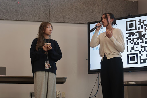 Answering caucus questions, freshman Rhaine Dahill gets interviewed on stage in front of Key Club members. While new board members were elected, their term does not officially begin until the District Convention in April. 
