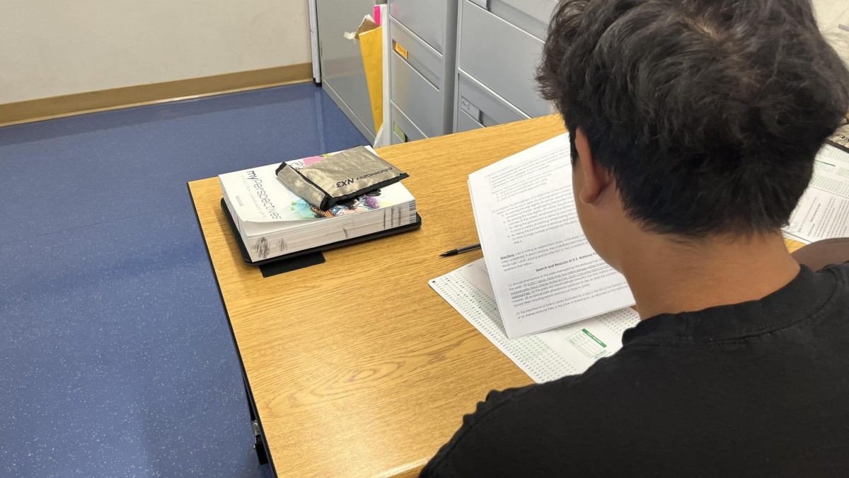 As students enter Journalism Foundations in Matthew LaPorte's classroom, they put their phones in the phone caddy. The phone caddy is placed in the front of the classroom on the whiteboard. “I feel like it’s unnecessary to completely ban self phones from school, but I feel like there are better regulations for having them on your person,” junior Jaidyn Eddington said.