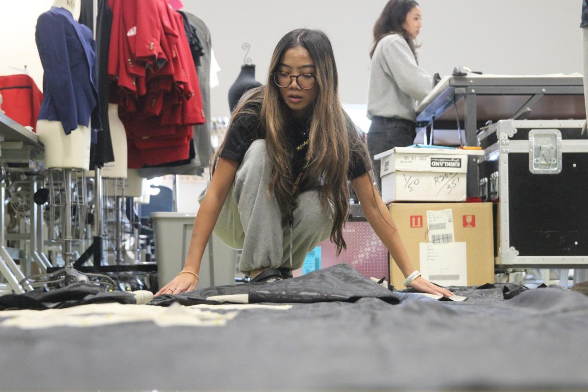 Arranging the fabric on the floor for a new project, senior Sapphyre-Ann Leung plans out her attire for the next deadline. With the recent closures, students now had limited resources and less margin for error with the fabric and materials they had in stock while trying to reach strict deadlines. “Joann’s had a lot of high-end fabric for our fashion competitions,” Leung said. “We couldn’t just buy ten yards of fabric from Hobby Lobby or Walmart. Since [Joann Fabrics] is no longer open, we have to buy items online, which is way more expensive.”