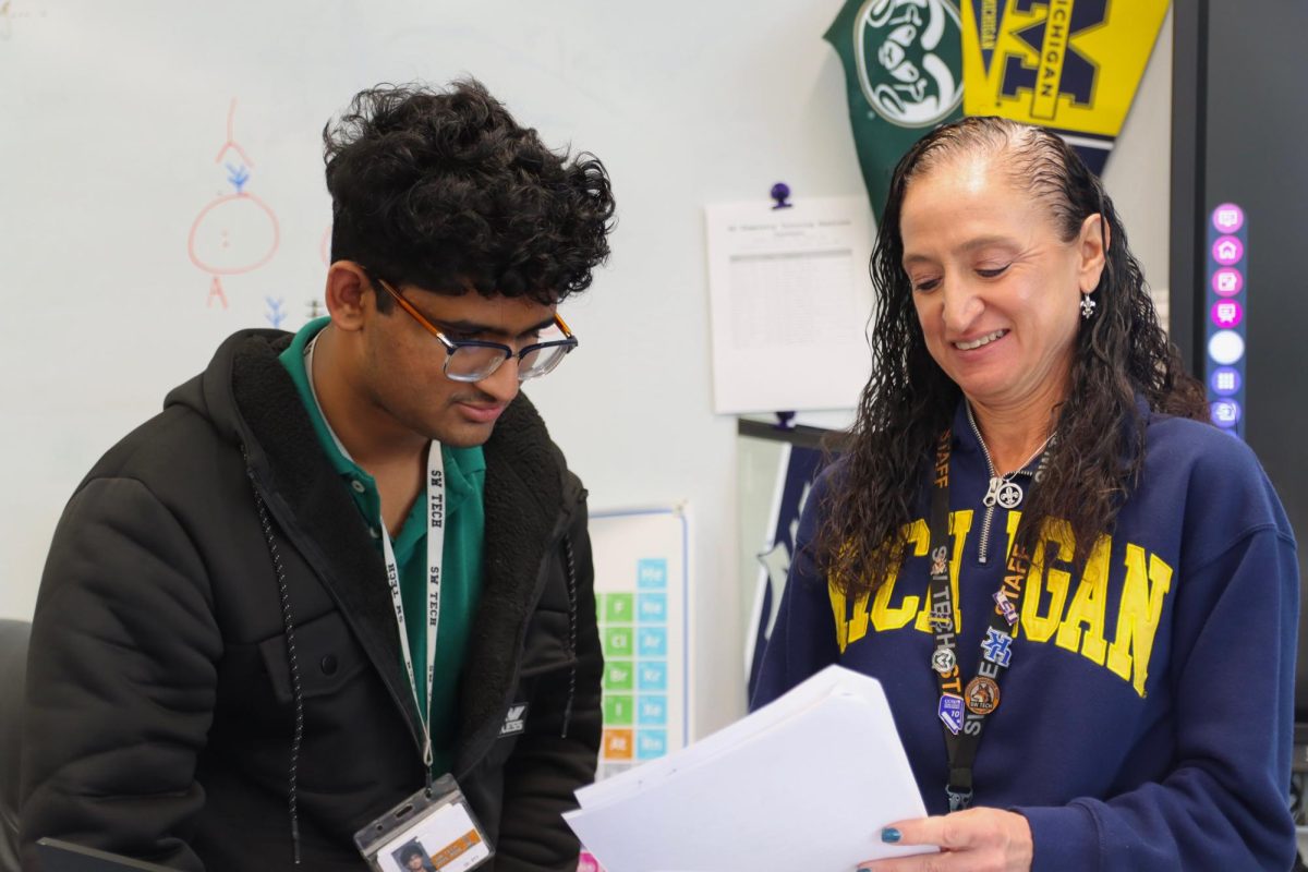 Guiding a student, Dr. Mary Breslin explains how to complete a lab assignment. Before becoming a teacher, Breslin spent years as a medical researcher, bringing her skills and experience to the classroom. “I would never leave here for absolutely no reason,” Breslin said. “I love the classes I get to teach, because I get to teach some of the classes that nobody else in the district gets to teach because of my background.”