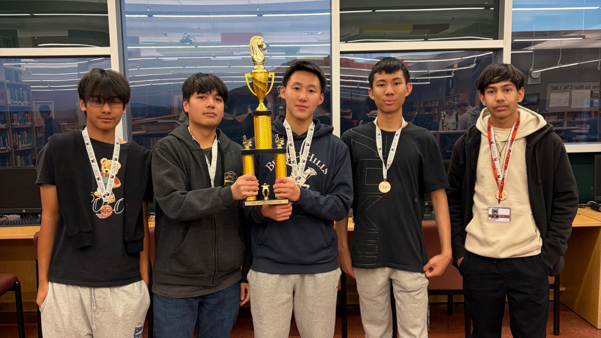 Lining up together, the Chess Club competitors hold their trophies. During the season, the team faced many challenging opponents, but still achieved victory through hard work. “To prepare for the division games, our team would meet after school to practice and decide who would be playing on which boards,” Chess Club adviser Chloe Hickman said. “We were placed in a pretty tough division this year, with West Tech and Coronado, who both placed in the Final Five in previous years.”

