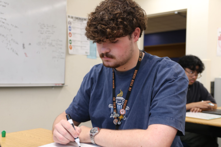 Working hard in math class, senior Preston Schwartz solves a calculus problem. In order to reach the GPA cap and attain valedictorian status, he took rigorous courses and maintained his grades. “Someone that impacted me in my journey was my sister,” Schwartz said. “She also went to Southwest, and she supported me and gave me insights on how to do well and how to be successful.”